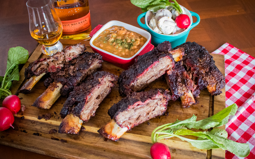 Image of a platter of slpw smoked barbecue Wagyu beef ribs